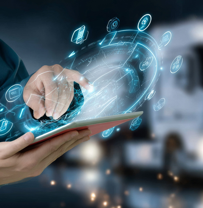 Digital Fleet Management with Smart Technology Person using a tablet with digital logistics interface in front of a blurred truck.