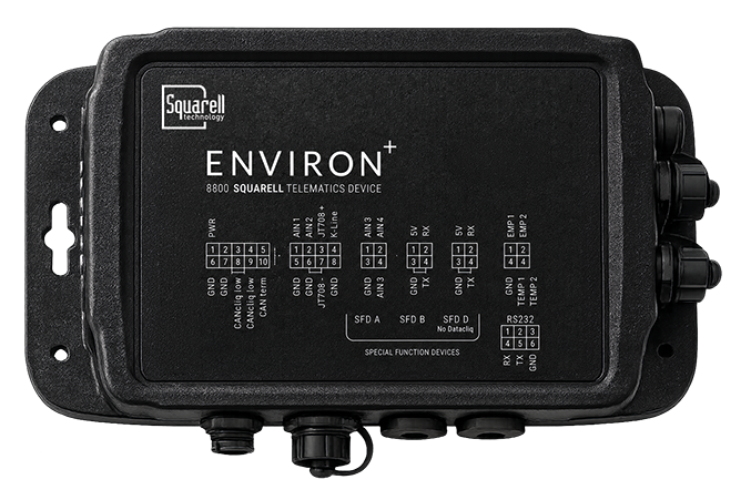 IAA DEF ENVIRON+_72dpi Squarrell Environ+ 8800 telematics device in a rugged black enclosure with multiple cable connectors and labeled input/output ports.