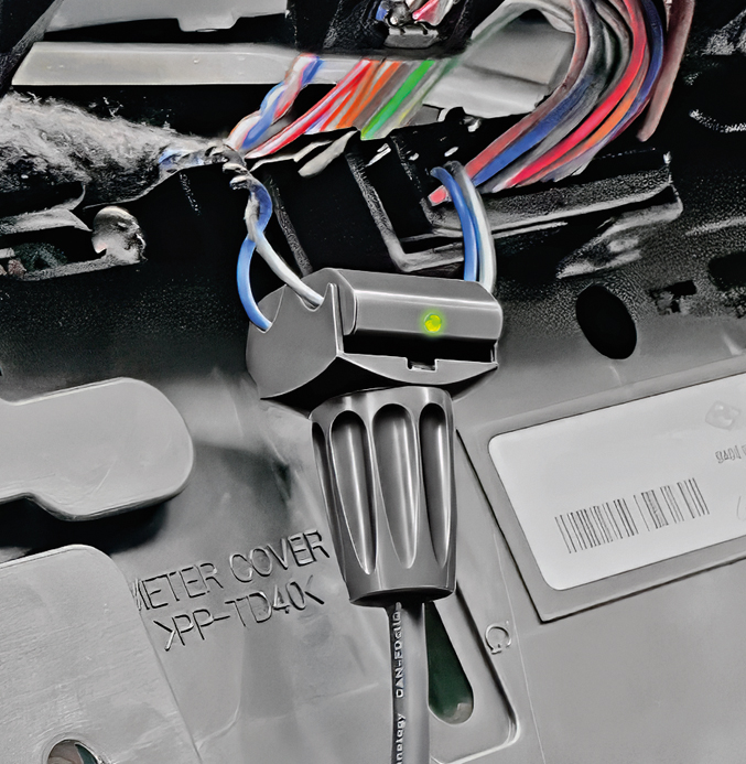 CANcliq NG Squarell CANcliQ NG installed around vehicle CAN bus wires for non-intrusive CAN data access.