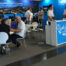 Visitors and representatives networking at the Squarell Technology exhibition booth, showcasing vehicle intelligence, fleet connectivity, and device management solutions.